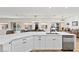 Modern kitchen featuring white countertops, stainless steel appliances, and access to a connected living space at 9612 Glengarry Dr, Las Vegas, NV 89129