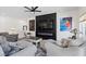 Comfortable living room featuring a modern fireplace, large TV, and stylish furnishings at 9612 Glengarry Dr, Las Vegas, NV 89129