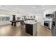 Spacious living room featuring an open concept design with a kitchen island and a billiard table at 9612 Glengarry Dr, Las Vegas, NV 89129