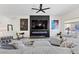 Comfortable living room featuring a modern fireplace, large TV, and stylish furnishings at 9612 Glengarry Dr, Las Vegas, NV 89129