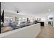 Bright and airy living room featuring an open layout connecting to the kitchen and backyard access at 9612 Glengarry Dr, Las Vegas, NV 89129