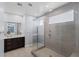 Bathroom with a glass shower, a vanity sink, and tiled walls at 9785 Granite Mesa St, Las Vegas, NV 89141