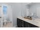 Bright bathroom featuring double sinks, granite counters, and tiled floors at 9785 Granite Mesa St, Las Vegas, NV 89141