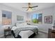 Bright bedroom featuring large windows and a ceiling fan at 9785 Granite Mesa St, Las Vegas, NV 89141