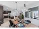 Dining area featuring modern lighting fixtures and large windows with natural light at 9785 Granite Mesa St, Las Vegas, NV 89141
