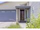 The front door features a modern design, with a large window and a welcoming doormat at 9785 Granite Mesa St, Las Vegas, NV 89141