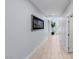 Hallway with tile floors, skylight, and a decorative picture on the wall at 9785 Granite Mesa St, Las Vegas, NV 89141