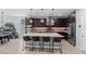 Modern kitchen with stainless steel appliances, quartz countertops, and dark cabinetry at 9785 Granite Mesa St, Las Vegas, NV 89141