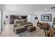 Open-concept living room flowing into the kitchen, with modern decor and ample seating at 9785 Granite Mesa St, Las Vegas, NV 89141