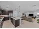 Open concept featuring a modern kitchen, living room, and bar stool seating at 9785 Granite Mesa St, Las Vegas, NV 89141