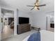 Modern main bedroom features a ceiling fan and a spacious layout with neutral color palette at 9785 Granite Mesa St, Las Vegas, NV 89141