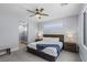 Serene main bedroom with neutral tones, a ceiling fan, and an attached bathroom at 9785 Granite Mesa St, Las Vegas, NV 89141