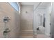 This modern glass shower features dual shower heads and built-in bench seating at 9785 Granite Mesa St, Las Vegas, NV 89141