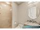 Guest bathroom featuring a tiled walk-in shower and granite vanity at 1 Hughes Center Dr # 903, Las Vegas, NV 89169