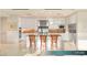 Spacious kitchen featuring stainless steel appliances, white cabinetry, and a breakfast bar with seating at 1 Hughes Center Dr # 903, Las Vegas, NV 89169