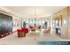 Bright living room with a fireplace, chandelier, floor to ceiling windows and city views at 1 Hughes Center Dr # 903, Las Vegas, NV 89169