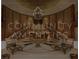 Elegant lobby featuring a grand staircase, chandelier, and seating areas at 1 Hughes Center Dr # 903, Las Vegas, NV 89169
