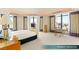 Bright main bedroom boasting floor to ceiling windows and views of the surrounding city at 1 Hughes Center Dr # 903, Las Vegas, NV 89169