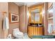 Elegant powder room with gold accents, decorative mirror, and stylish fixtures at 1 Hughes Center Dr # 903, Las Vegas, NV 89169