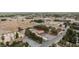 This aerial view displays this desert community, featuring solar panels, dirt roads, and a spacious property at 1050 Morgan Ln, Pahrump, NV 89060