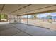 Expansive backyard view from covered patio with playset and lots of space at 1050 Morgan Ln, Pahrump, NV 89060