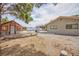 Large backyard featuring a shed, house, solar panels, and a covered area at 1050 Morgan Ln, Pahrump, NV 89060
