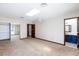 Bright bedroom with skylight, neutral carpeting and decor, adjacent to the bath and living space at 1050 Morgan Ln, Pahrump, NV 89060