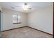 Simple bedroom featuring neutral walls, carpet flooring, and a window with blinds at 1050 Morgan Ln, Pahrump, NV 89060