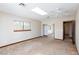 Bedroom with skylight, neutral walls and carpet, and closet with mirrored sliding doors at 1050 Morgan Ln, Pahrump, NV 89060