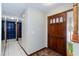 Foyer features tile flooring and a mirrored wall leading to blue cabinets at 1050 Morgan Ln, Pahrump, NV 89060