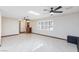 Bright living room with black brick fireplace, tile floors, and natural light at 1050 Morgan Ln, Pahrump, NV 89060