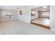 Open-concept living room featuring tile flooring and a view of the modern kitchen area at 1050 Morgan Ln, Pahrump, NV 89060