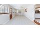Bright and spacious living room offering tile floors, natural light, and a side door entrance at 1050 Morgan Ln, Pahrump, NV 89060