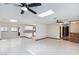 Bright, open living space featuring tile floors, skylights, and ample natural light at 1050 Morgan Ln, Pahrump, NV 89060