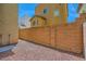 A cozy backyard with low-maintenance rock landscaping and a brick perimeter wall at 10725 Wrigley Field Ave, Las Vegas, NV 89166
