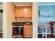 Wet bar with cabinet storage, countertop, and cooler at 10725 Wrigley Field Ave, Las Vegas, NV 89166
