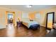 Bedroom with wood floors and neutral decor for a calm feel at 10725 Wrigley Field Ave, Las Vegas, NV 89166