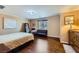 Bedroom with wood floors, natural light, and neutral colors give the room a relaxed feel at 10725 Wrigley Field Ave, Las Vegas, NV 89166