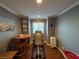 Bonus room featuring a table, chairs, a window and an inversion table on wood-look floors at 10725 Wrigley Field Ave, Las Vegas, NV 89166