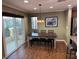Cozy dining area with a wooden table and bench seating adjacent to a patio at 10725 Wrigley Field Ave, Las Vegas, NV 89166