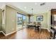 Dining area with ample light, table, bench seating, and sliding glass door access to the outside at 10725 Wrigley Field Ave, Las Vegas, NV 89166