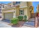 Stylish three-story home featuring a two-car garage and manicured landscaping at 10725 Wrigley Field Ave, Las Vegas, NV 89166