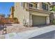 Beautiful three-story home with a two-car garage, featuring a private, brick paved parking area at 10725 Wrigley Field Ave, Las Vegas, NV 89166