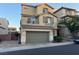 Inviting two-story home with a two-car garage and charming architectural details at 10725 Wrigley Field Ave, Las Vegas, NV 89166