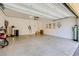 Spacious garage with epoxy floor, offering ample room for parking and storage, plus a water treatment system at 10725 Wrigley Field Ave, Las Vegas, NV 89166