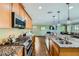 Bright kitchen featuring stainless steel appliances, granite countertops, and seamless flow into the living area at 10725 Wrigley Field Ave, Las Vegas, NV 89166