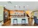 Well-appointed kitchen featuring an island with bar seating, stainless appliances, and decorative pendant lights at 10725 Wrigley Field Ave, Las Vegas, NV 89166