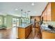 Gourmet kitchen featuring granite countertops, stainless steel appliances, and an island with pendant lighting at 10725 Wrigley Field Ave, Las Vegas, NV 89166