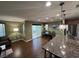 Bright open-concept layout connecting the living, dining, and kitchen areas at 10725 Wrigley Field Ave, Las Vegas, NV 89166