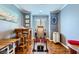 Office area with wood floors, natural light, and serene blue paint at 10725 Wrigley Field Ave, Las Vegas, NV 89166